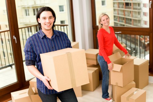 Removal company staff managing items during a property move